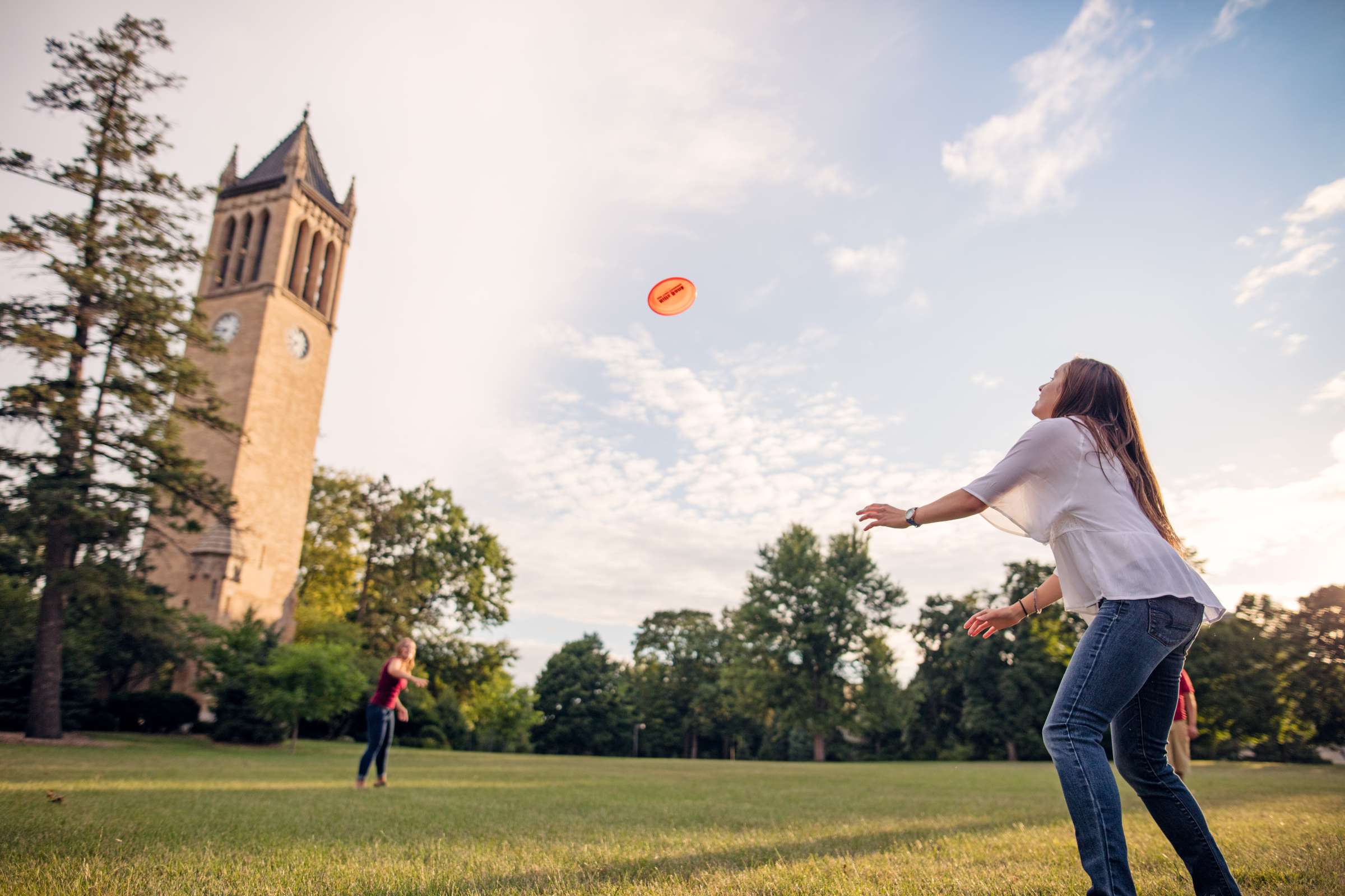 Students playing frisbee