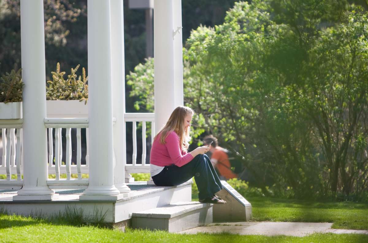 Female student sitting outside